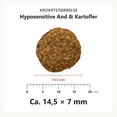 Kroketstørrelse for Dr. Clauder's Hyposensitive And & Kartofler: ca. 14,5 × 7 mm vist ved en mm-lineal.